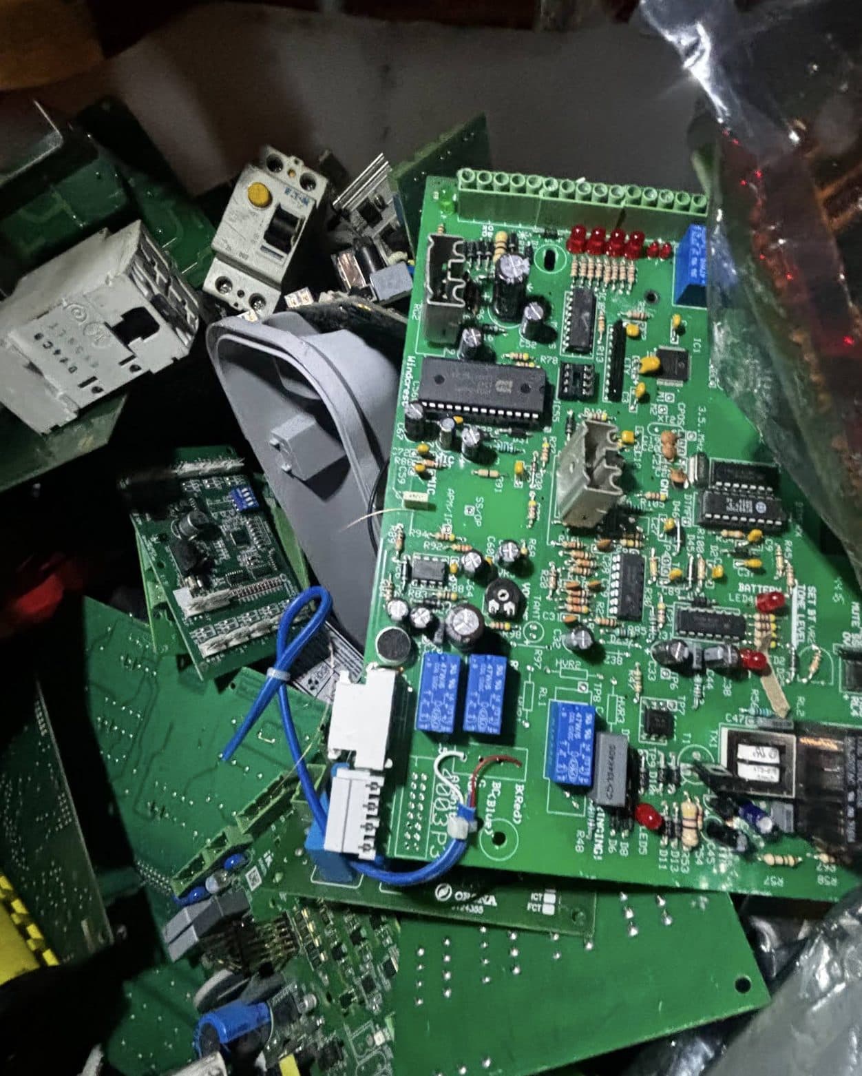 Circuit boards, contactors and electrical components loaded for recycling